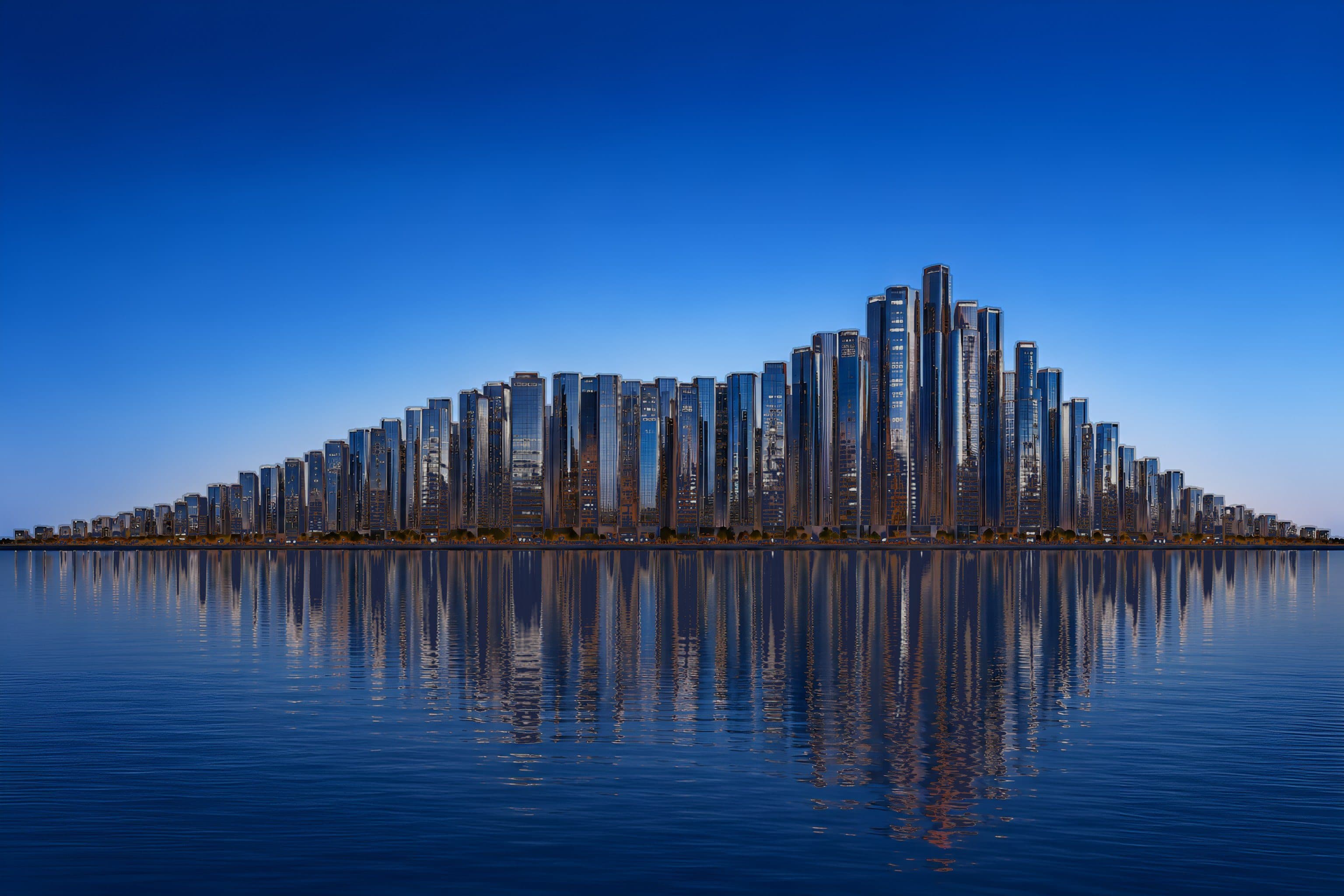 A city skyline at dusk across still water, its towers rising to a peak right of centre. As the forecast line crosses the rooftops, the lights come on.